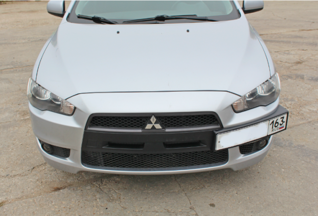 Рамка под номер на передний бампер для Mitsubishi Lancer X (2007-2016)